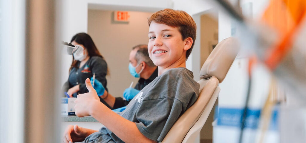 Boy happy with his orthodontist consult