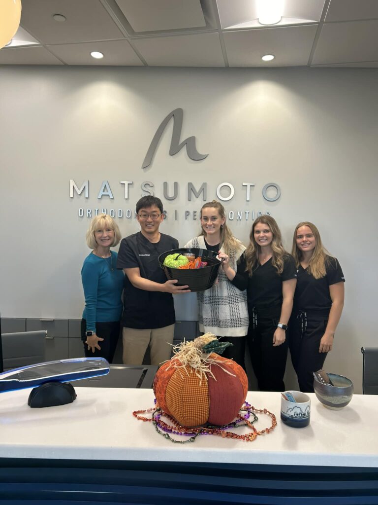 Dr. Matsumoto and team, smiling, Halloween, braces, Invisalign, MSE, MARPE in Porters Neck, Wilmington, NC