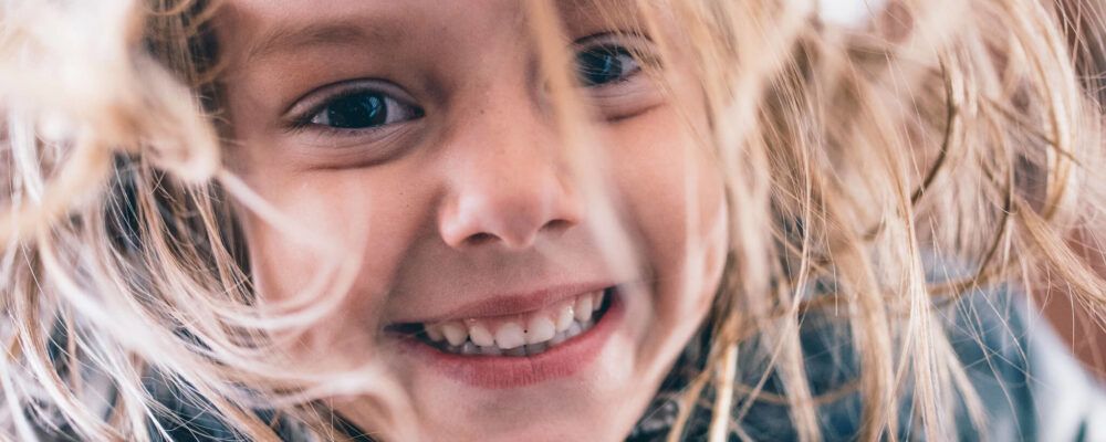 Funny girl celebrating pediatric dental health month