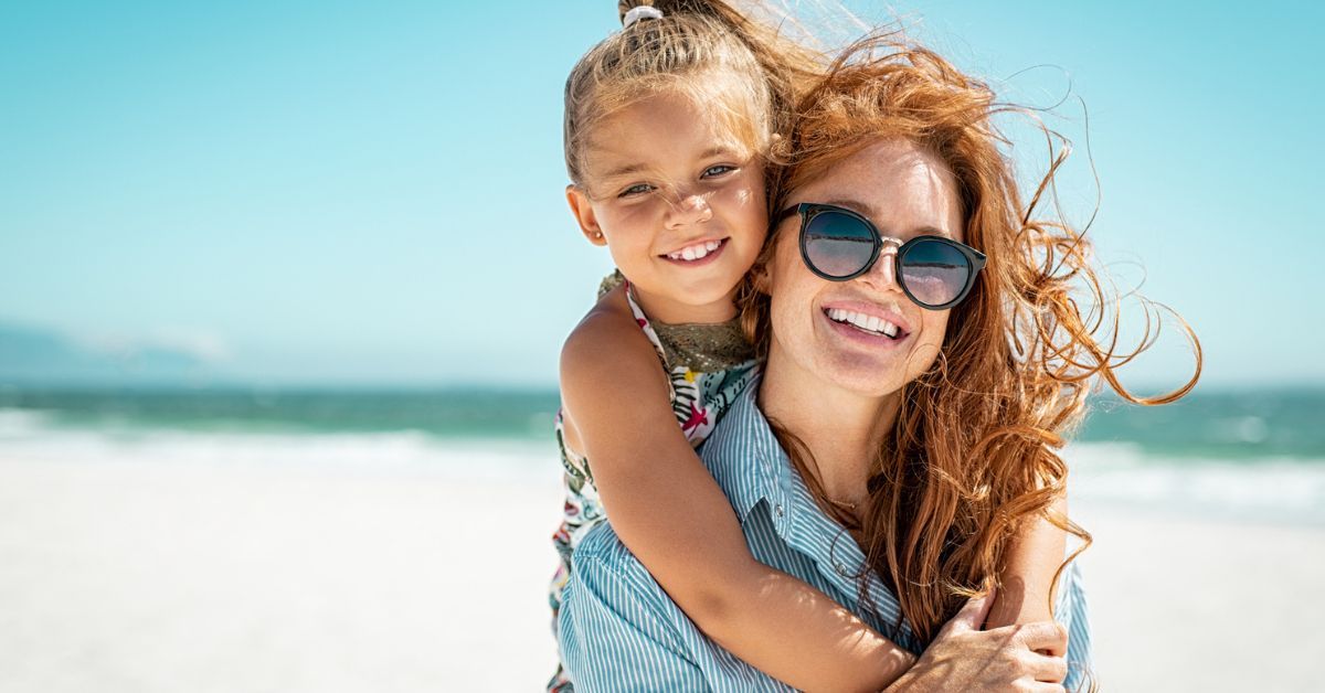 mother and daughter on the beach talk about Braces at age 7
