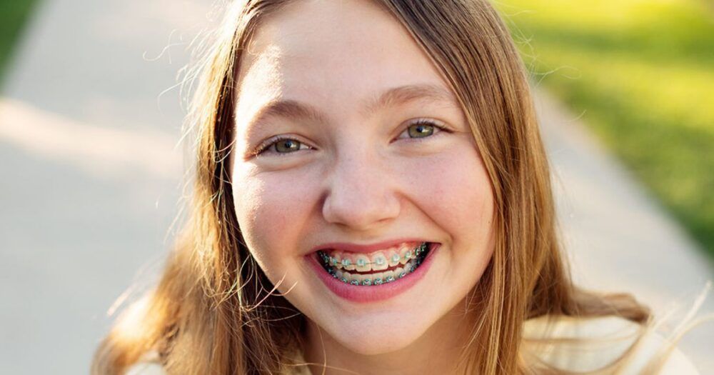 girl wearing braces rubber bands
