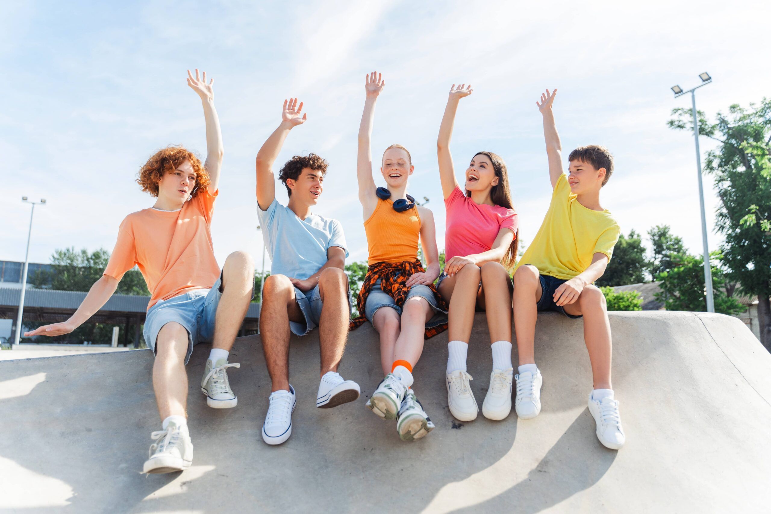 Portrait of smiling teenagers, children wearing stylish casual clothes